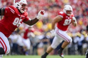 Nose tackle Keeanu Benton runs during a football game.