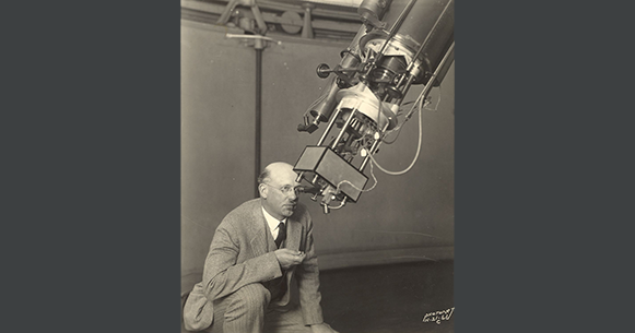 Joel Stebbins looking into a telescope.