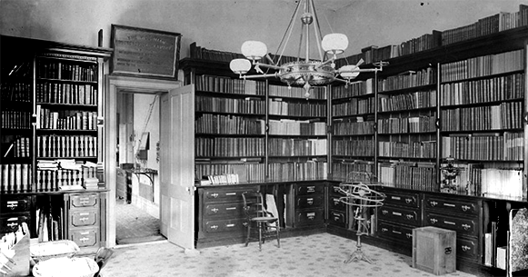 Historic photo of Cyrus Woodman's library.