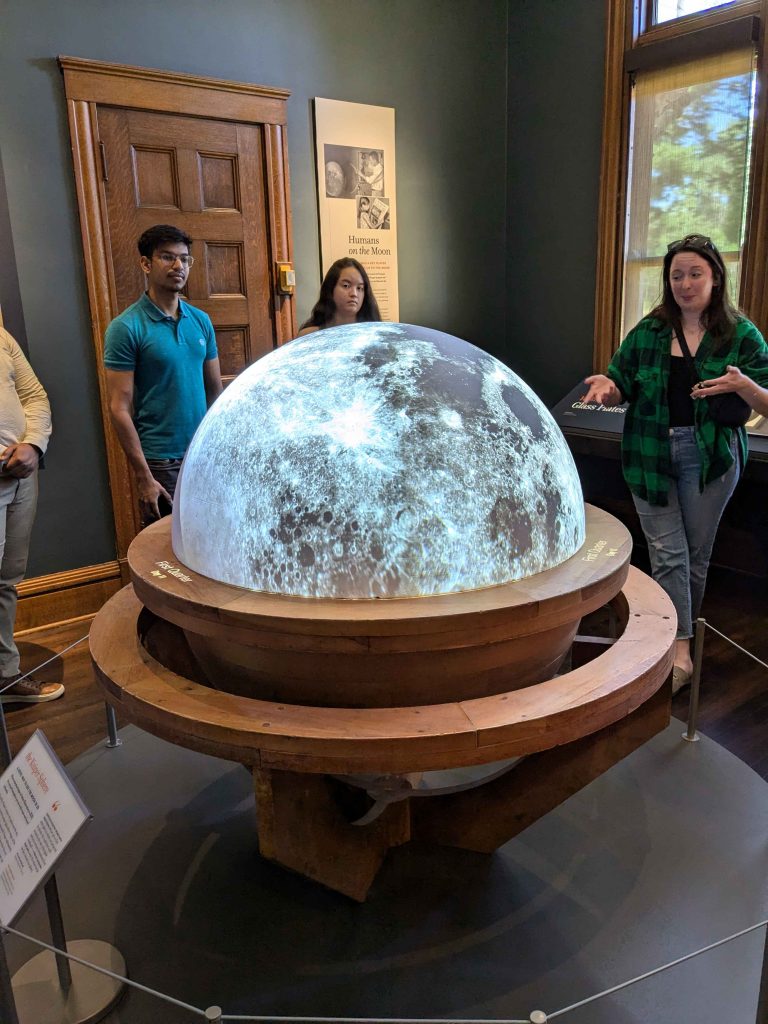 RADIAL students stand in front of the Kuiper Sphere at Yerkes Observatory.